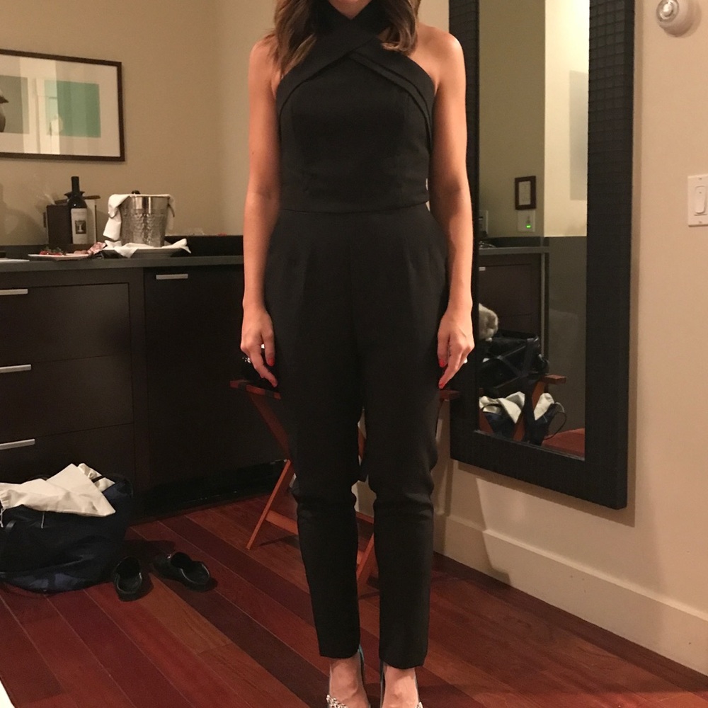 Black jumpsuit with around the neck clasp
